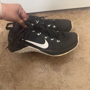Women’s black Nike metcons